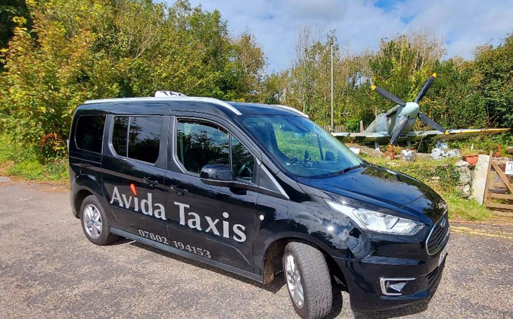 Avida taxi parked in front of spitfire