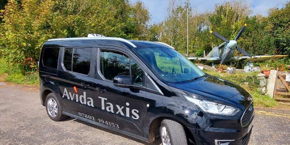 Avida taxi parked in front of spitfire
